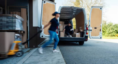 movers packing belongings in a moving truck